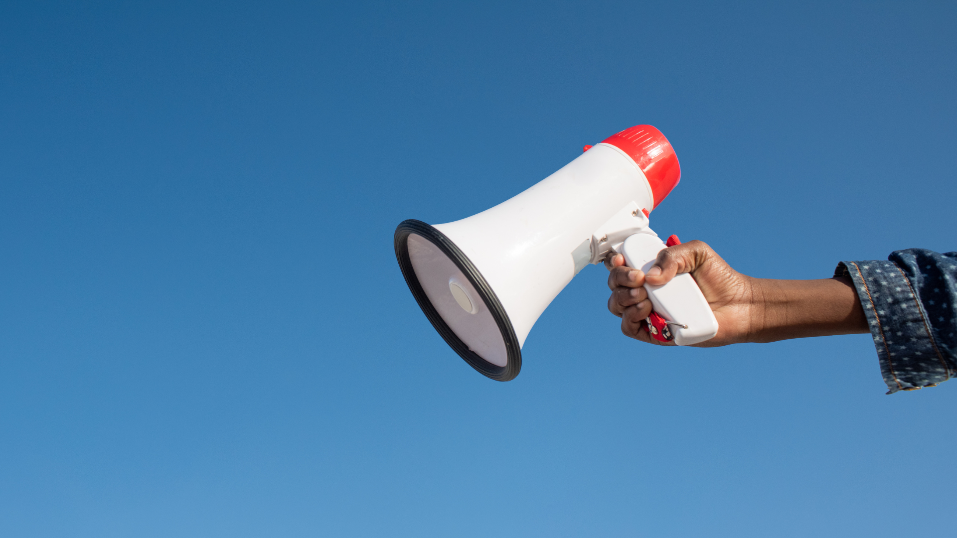 Arm holding a megaphone